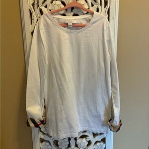 Burberry girls solid white top with pattern cuff trim.